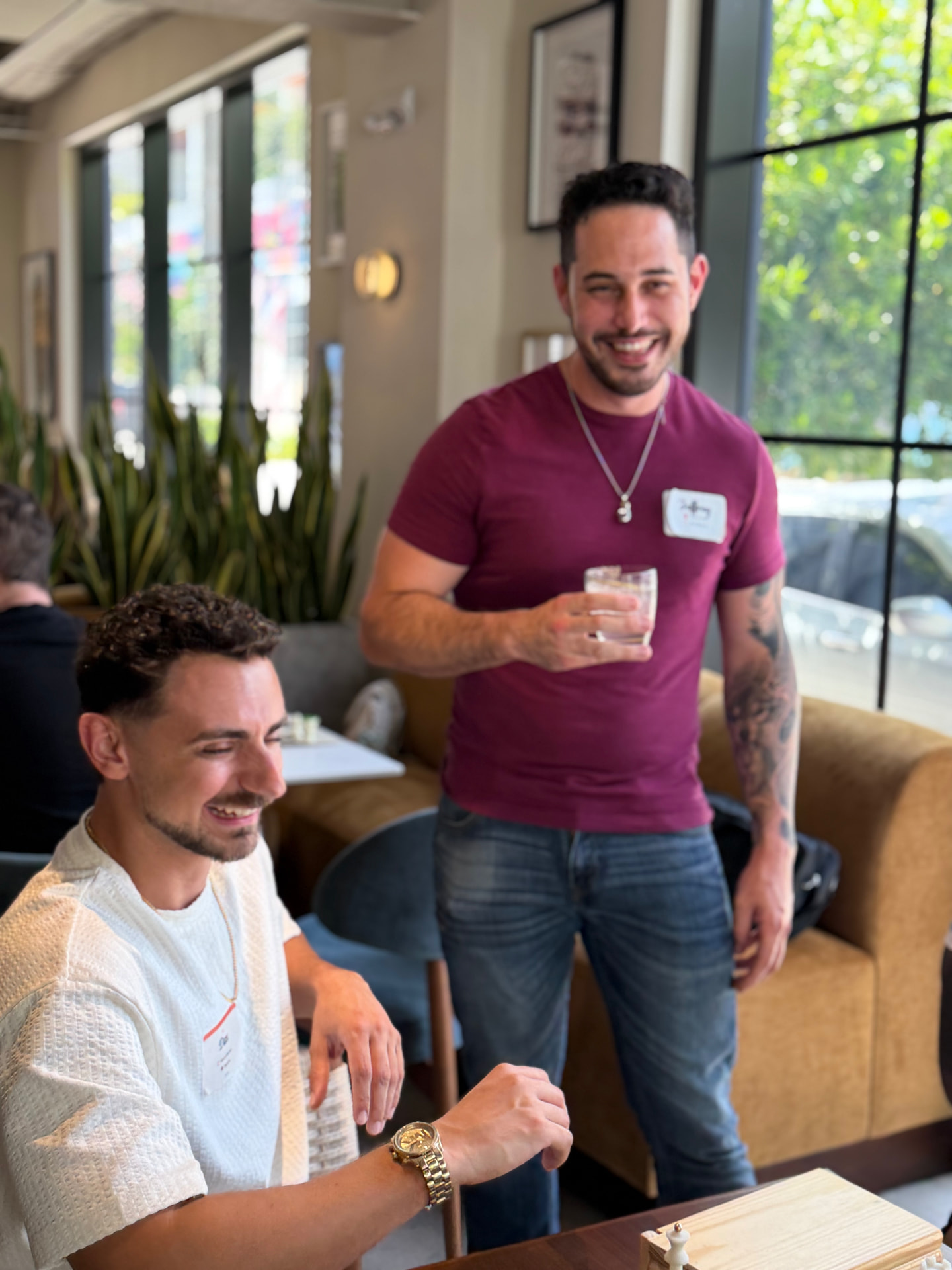 Guests connecting and laughing at a Convive social in Miami
